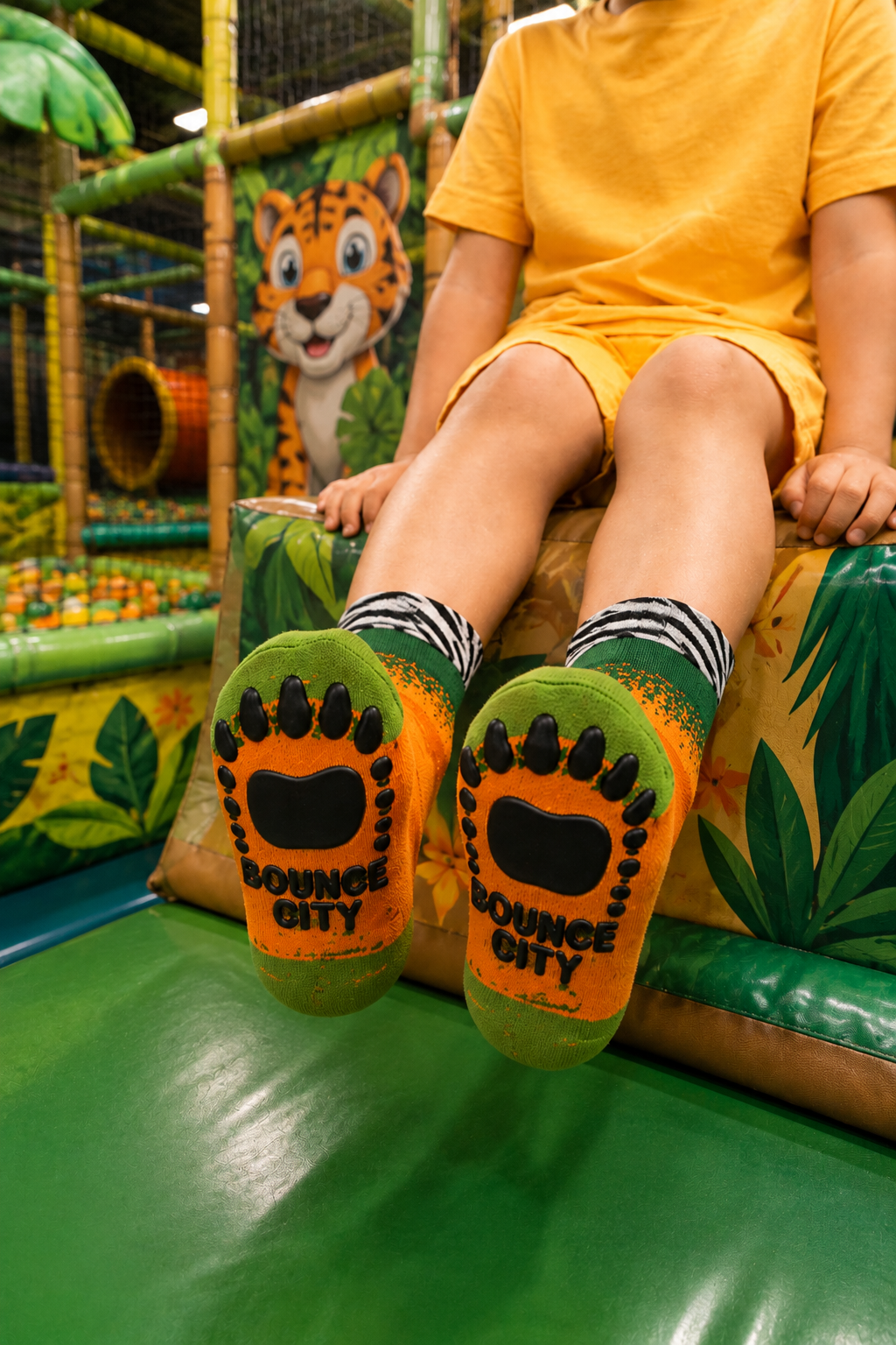 Bounce City trampoline grip socks with orange tiger paw design required for play in Brandon, FL